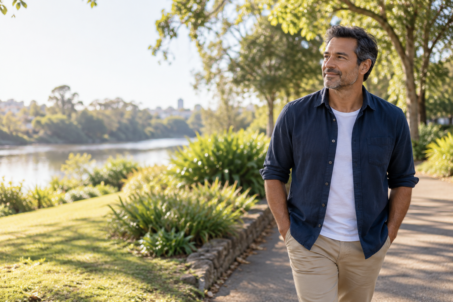 A man enjoying a quiet moment in a leafy park